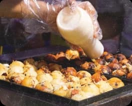 Exploring bustling street markets of Osaka and savoring takoyaki.